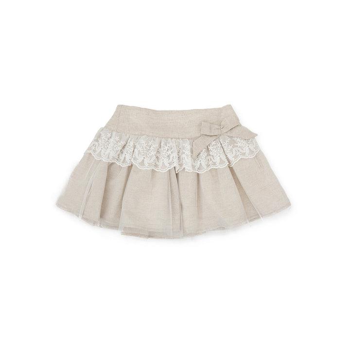 Sand-colored Kendo woven skirt for kids, offering a versatile and stylish summer wardrobe option with a relaxed fit.