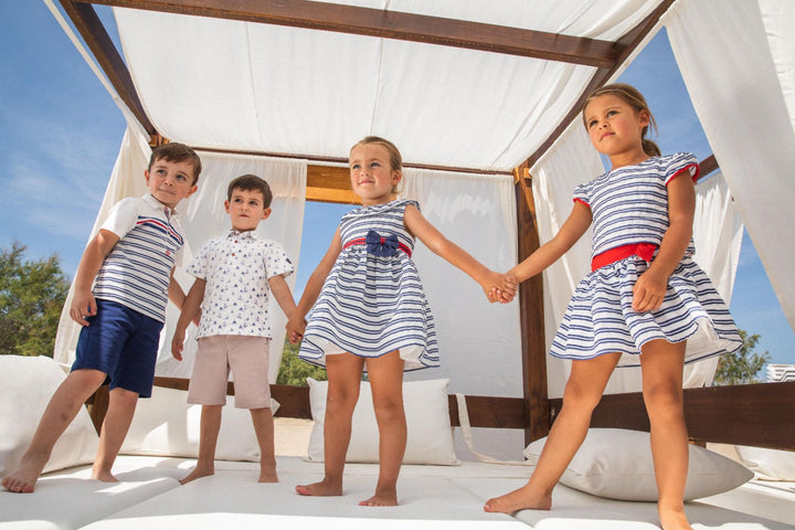 Navy blue Regata knitted polo neck for kids, combining classic style with comfort for a versatile summer wardrobe staple.