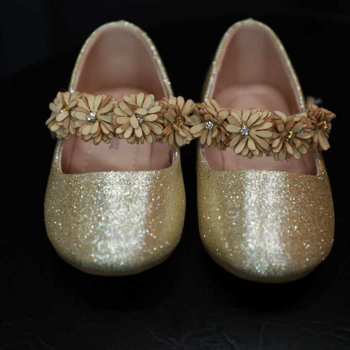 Gold Mary Jane shoes for baby girls.